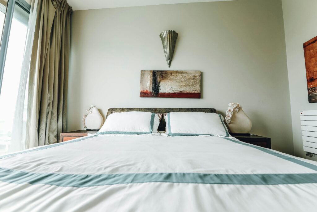 A stylish bedroom featuring contemporary furnishings and minimalist design.